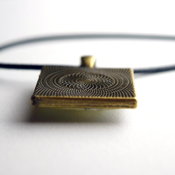 'ANCIENT BABY' PENDANT -- PHOTOGRAPHY BY VIOLET BIGGS - Picture 3 of 6